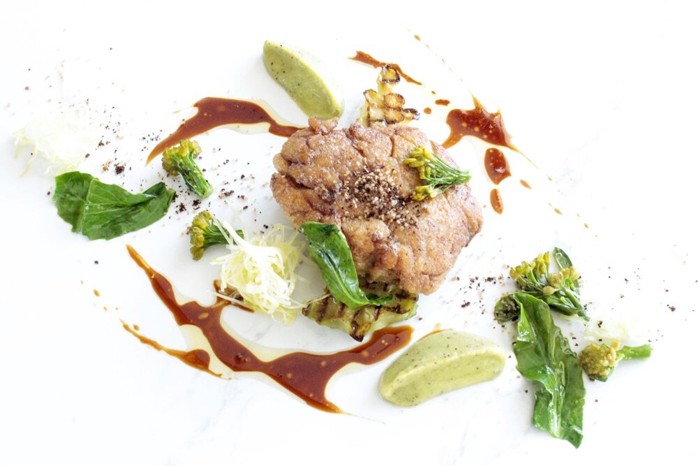 Pan-seared veal sweetbread with broccoli declination, rye crumble and arabica sauce